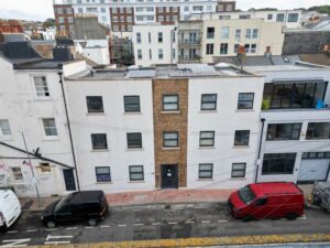 Residential building in Brighton and Hove with freshly cleaned render after professional softwash treatment