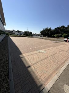 Freshly pressure washed and resanded block paving at a commercial property in Worthing